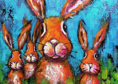 Four whimsical rabbits in a field